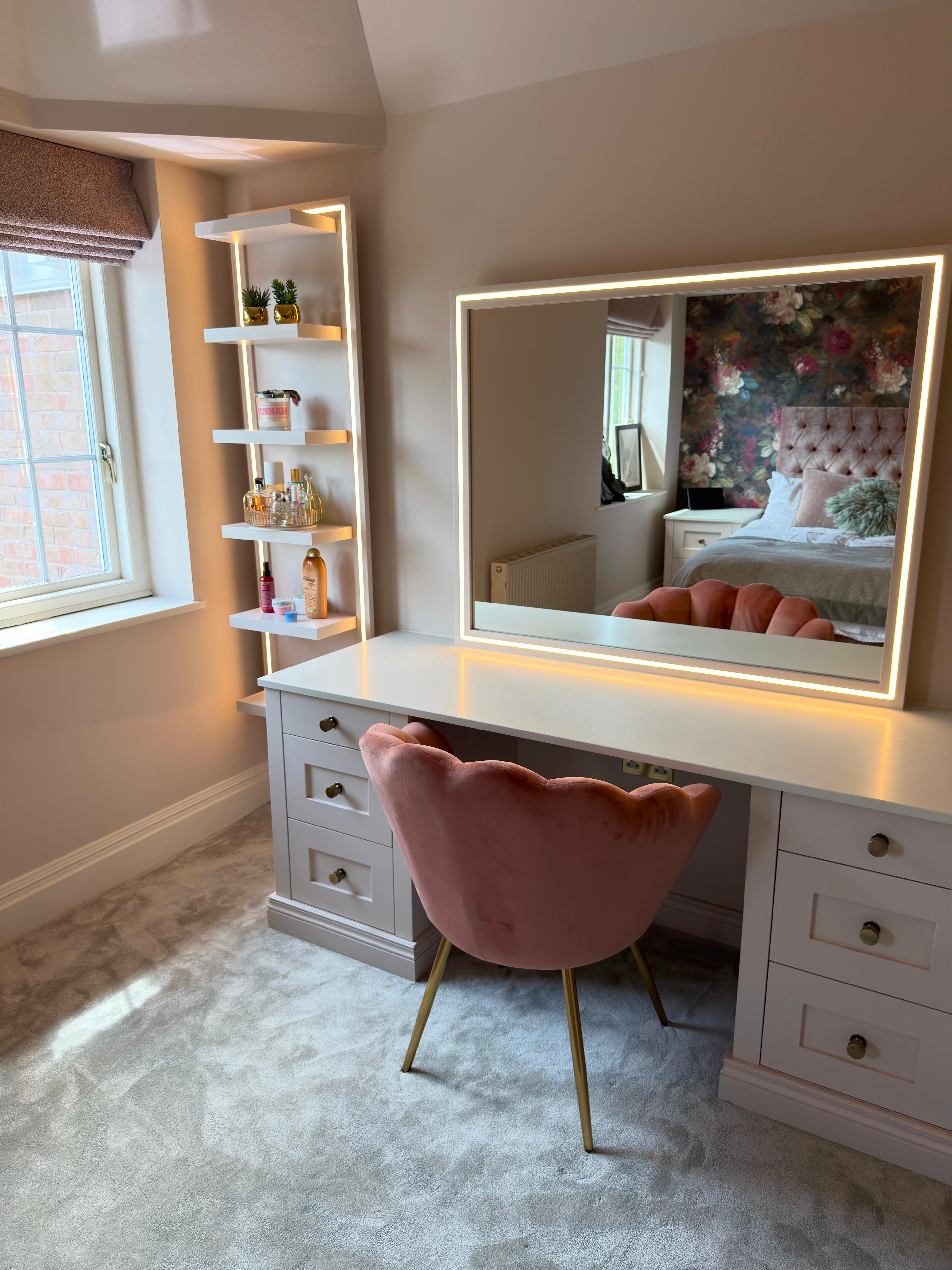 Bespoke pink bedroom with fitted furniture