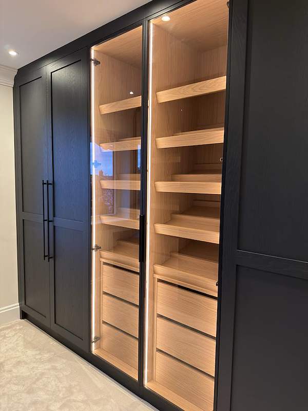 Luxury fitted wardrobe with bespoke interior details